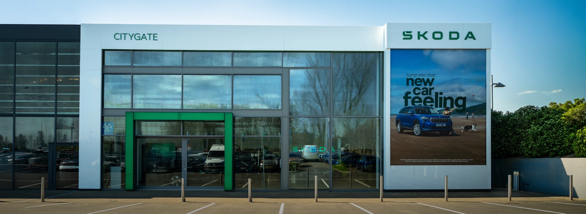 Modern exterior front view of the Škoda Citygate dealership showroom.