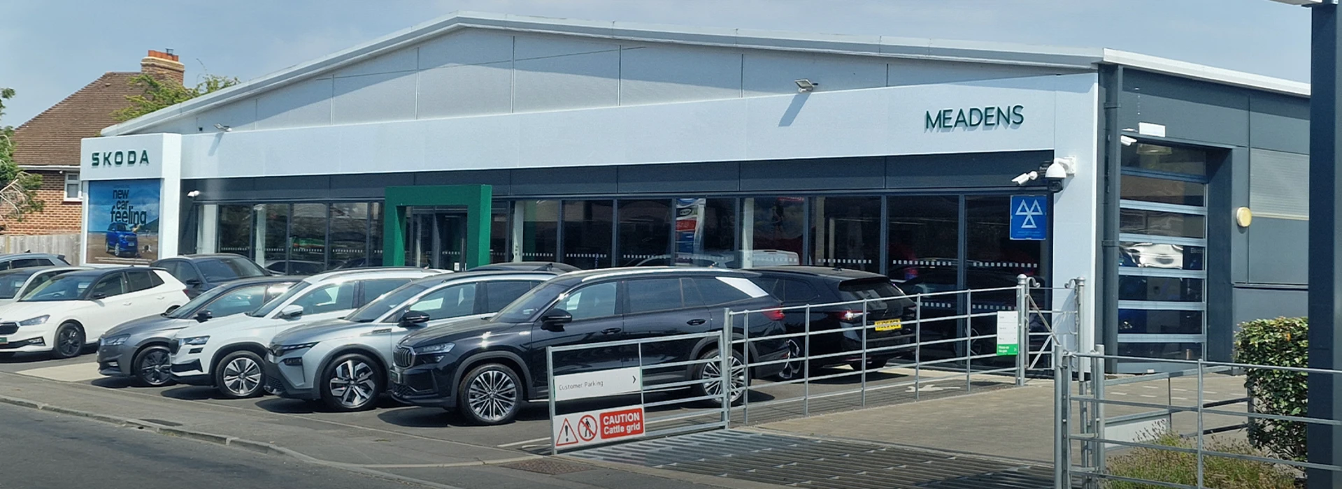 Škoda Meadens Brockenhurst dealership forecourt filled with parked cars outside the showroom.