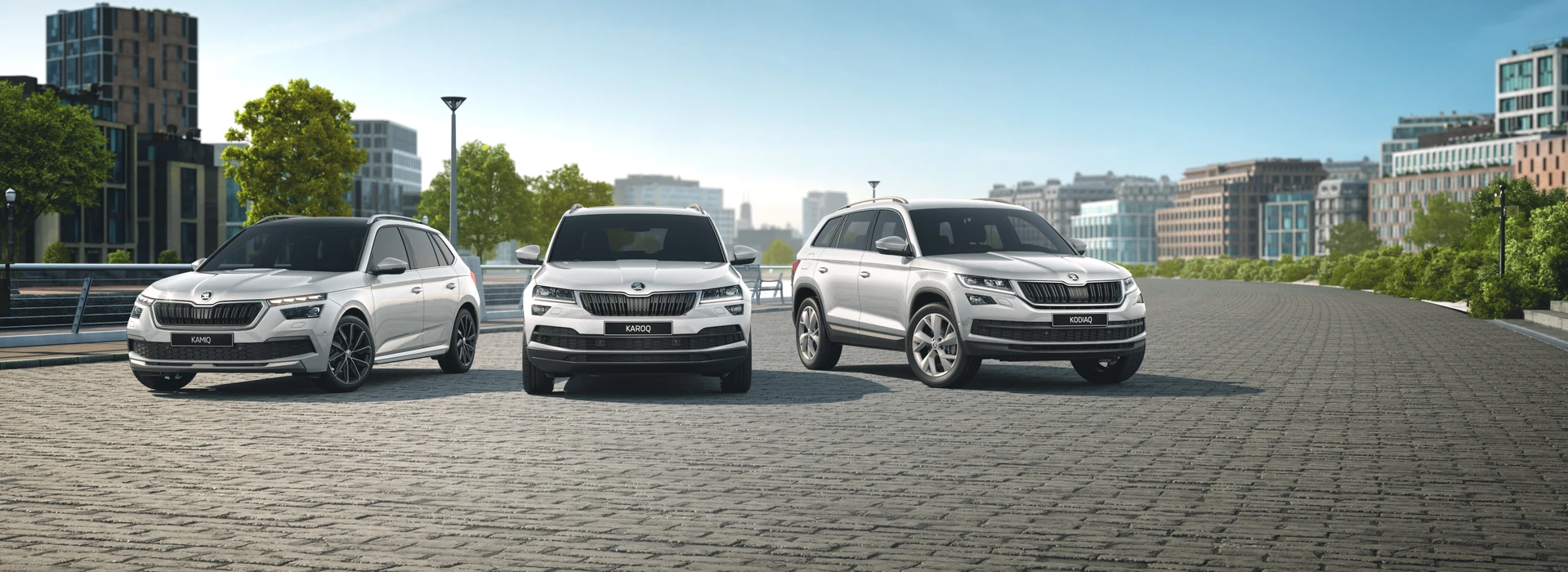 SKODA SUV range of vehicles beauty shot of white KAMIQ, white KODIAQ and white KAROQ