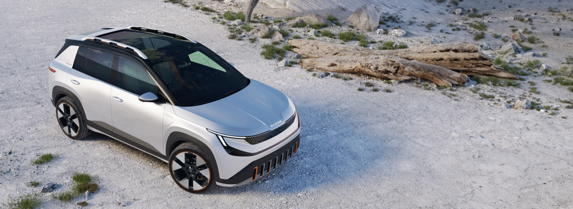 Skoda Epiq staat geparkeerd in bergachtig landschap, het zicht is van schuinboven